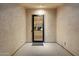 Modern entryway with a sleek black-framed glass door and a neutral-toned foyer at 3574 E Tonto Pl, Chandler, AZ 85249