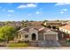 Charming single-story home with a well-manicured lawn and a two-car garage in a peaceful neighborhood at 3574 E Tonto Pl, Chandler, AZ 85249
