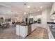 Spacious kitchen with white cabinetry, a central island, stainless steel appliances, and an open floor plan at 3574 E Tonto Pl, Chandler, AZ 85249