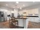 Bright kitchen features white cabinets, black countertops, and stainless steel appliances at 3574 E Tonto Pl, Chandler, AZ 85249