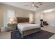 Comfortable main bedroom with ample natural light, tile floors, and neutral color palette at 3574 E Tonto Pl, Chandler, AZ 85249
