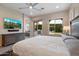 Bright main bedroom with backyard access, tiled floors, and neutral decor at 3574 E Tonto Pl, Chandler, AZ 85249
