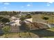 Aerial view of a community park featuring covered playgrounds, green spaces, and walking paths at 3574 E Tonto Pl, Chandler, AZ 85249