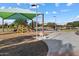 Community park featuring a covered playground, walking paths, and nearby ramadas at 3574 E Tonto Pl, Chandler, AZ 85249