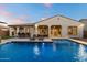 Beautiful pool with a Baja shelf and bar seating with a covered outdoor space, ideal for outdoor living at 3574 E Tonto Pl, Chandler, AZ 85249