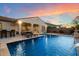 Stunning backyard showcasing the pool, lounge chairs, outdoor seating, and kitchen area for relaxation and entertainment at 3574 E Tonto Pl, Chandler, AZ 85249