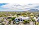 Stunning aerial view of the home and surrounding community, showcasing the desert landscape and mountain backdrop at 36075 N Summit Dr, Cave Creek, AZ 85331