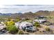Picturesque aerial view of the home, displaying the desert landscape and nearby mountain vistas at 36075 N Summit Dr, Cave Creek, AZ 85331