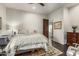 Cozy bedroom with hardwood floors, soft lighting, and a view to the hallway at 36075 N Summit Dr, Cave Creek, AZ 85331