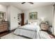 Bright bedroom with hardwood floors, a tufted headboard and ensuite bath access at 36075 N Summit Dr, Cave Creek, AZ 85331