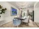 Dining room with a modern chandelier, elegant decor, and seating for six people at 36075 N Summit Dr, Cave Creek, AZ 85331