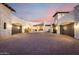 Grand stucco home featuring a wide paved driveway and multiple garage entrances at 36075 N Summit Dr, Cave Creek, AZ 85331