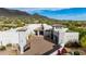 Expansive estate displaying stunning architecture, desert landscaping, and a grand gated entrance at 36075 N Summit Dr, Cave Creek, AZ 85331
