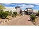 Charming home featuring a circular driveway, desert landscaping, and a beautiful architectural style at 36075 N Summit Dr, Cave Creek, AZ 85331