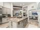 Open kitchen layout showcases a large island and views of the living and dining areas at 36075 N Summit Dr, Cave Creek, AZ 85331