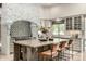 Stylish kitchen with a central island, stone accents, and counter seating at 36075 N Summit Dr, Cave Creek, AZ 85331