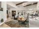 Expansive living room with a large chandelier and access to multiple living spaces at 36075 N Summit Dr, Cave Creek, AZ 85331