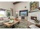Cozy living room features a fireplace, built-in media center, and comfortable seating at 36075 N Summit Dr, Cave Creek, AZ 85331