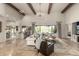 Bright living room with high ceilings, exposed beams, and an open floor plan at 36075 N Summit Dr, Cave Creek, AZ 85331