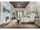 Spacious main bedroom features a fireplace, four poster bed, and access to an outdoor balcony at 36075 N Summit Dr, Cave Creek, AZ 85331