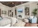 Bright bedroom with a fireplace and built in shelves features a four poster bed at 36075 N Summit Dr, Cave Creek, AZ 85331