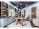 Stylish office space with custom shelving, a unique wooden desk, and plenty of natural light at 36075 N Summit Dr, Cave Creek, AZ 85331