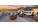Comfortable wicker furniture arrangement on the patio offers a relaxing outdoor living space with scenic views at 36075 N Summit Dr, Cave Creek, AZ 85331