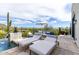 Relaxing pool-side lounge area with chaise lounges and scenic desert views, perfect for outdoor enjoyment at 36075 N Summit Dr, Cave Creek, AZ 85331