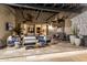 Inviting outdoor patio with stone accents, featuring comfortable seating and ceiling fans for a relaxing experience at 36075 N Summit Dr, Cave Creek, AZ 85331