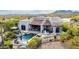 Inviting backyard pool with patio seating and desert views, perfect for relaxing and entertaining at 36075 N Summit Dr, Cave Creek, AZ 85331