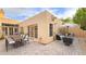 Spacious backyard features a dining table, seating, and umbrella, designed for outdoor enjoyment and entertainment at 5756 N 78Th Pl, Scottsdale, AZ 85250