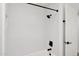 Bright bathroom boasts a clean, white-tiled shower and black fixtures for a sophisticated design at 5756 N 78Th Pl, Scottsdale, AZ 85250