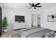 Cozy bedroom with a ceiling fan, modern décor, and closet at 5756 N 78Th Pl, Scottsdale, AZ 85250