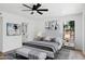 Bright bedroom with a ceiling fan, modern décor, and an ensuite bathroom at 5756 N 78Th Pl, Scottsdale, AZ 85250
