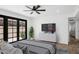 Well-lit bedroom with a ceiling fan, modern decor, and ample storage at 5756 N 78Th Pl, Scottsdale, AZ 85250