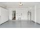 Spacious garage features ample storage cabinets, utility sink, and access to the home's interior at 5756 N 78Th Pl, Scottsdale, AZ 85250