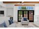 Cozy living room featuring a wet bar, black framed windows, beamed ceilings and stylish furniture at 5756 N 78Th Pl, Scottsdale, AZ 85250