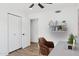 Bright home office with dual closets, wood-look flooring, and storage at 5756 N 78Th Pl, Scottsdale, AZ 85250