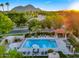 A resort-style pool area with cabana, mountain views, lush landscaping, and a separate jacuzzi at 5756 N 78Th Pl, Scottsdale, AZ 85250