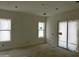 Spacious Gathering room features large windows and sliding glass doors for natural light at 6452 E Omega Cir, Mesa, AZ 85215