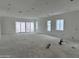 Bright and spacious living room offers ample natural light from large windows and glass doors at 6452 E Omega Cir, Mesa, AZ 85215