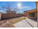 Spacious backyard with brick wall and concrete patio at 8009 S 53Rd Ave, Laveen, AZ 85339