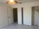 Bright bedroom featuring an open closet and tile floors at 8009 S 53Rd Ave, Laveen, AZ 85339