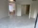 Neutral main bedroom featuring tile floors, high ceilings, and an ensuite bathroom at 8009 S 53Rd Ave, Laveen, AZ 85339