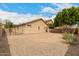 View of the back of the property, featuring landscaping and a backyard at 10317 E Kiva Cir, Mesa, AZ 85209
