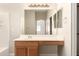 A bathroom featuring a vanity and a large mirror at 10317 E Kiva Cir, Mesa, AZ 85209