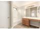 A bathroom featuring a vanity and a shower/tub combo at 10317 E Kiva Cir, Mesa, AZ 85209