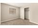 The bedroom has carpet, a window for natural light, and closet space at 10317 E Kiva Cir, Mesa, AZ 85209