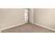 The bedroom has carpet and a view into another room at 10317 E Kiva Cir, Mesa, AZ 85209