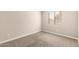 This bedroom has neutral carpeting, warm paint and a window providing natural light at 10317 E Kiva Cir, Mesa, AZ 85209